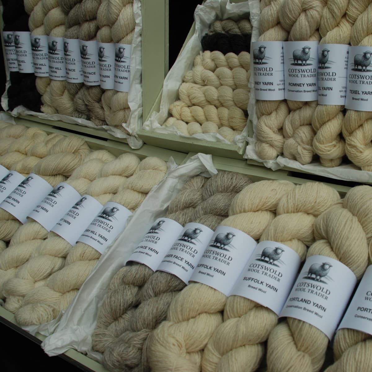 Display of Cotswold Wool Traders yarn with labelled skeins.